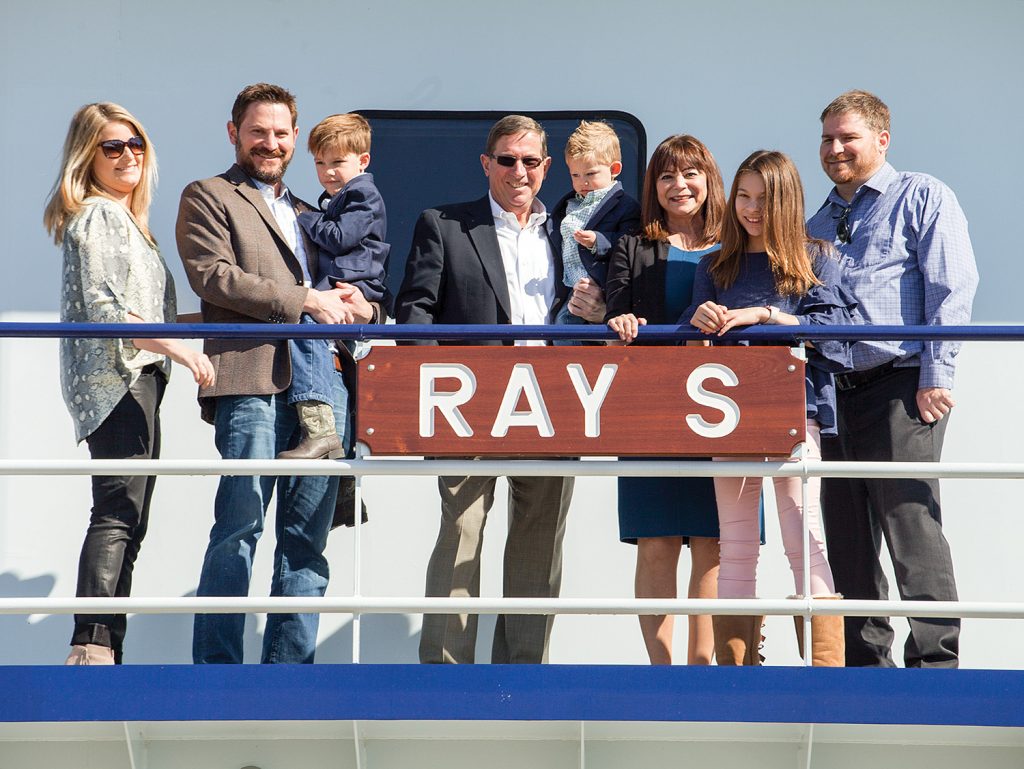 Ray Sick, center, with family aboard the newly christened mv. Ray S.