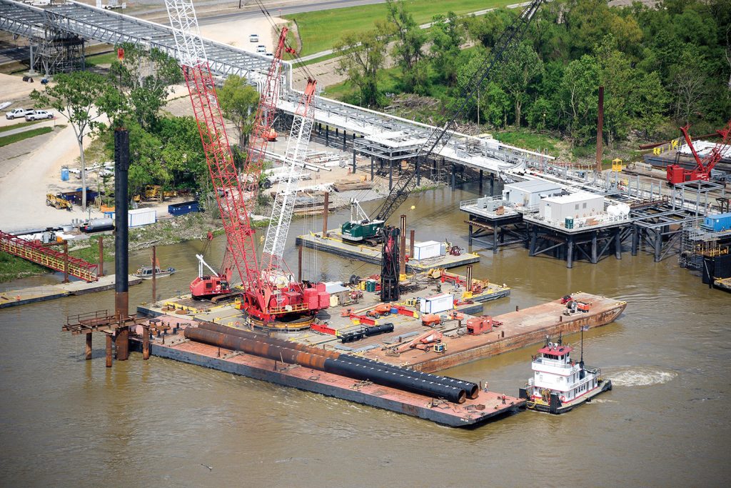 Massman equipment and crews at work constructing the dock.(Photo courtesy of Massman Construction Company)