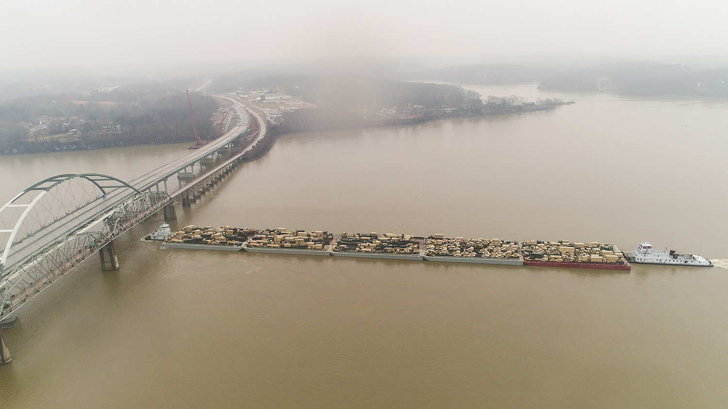 Pushed by the mv. Graestone Express with assist from the mv. Lewis Reed, the flotilla goes under the Highway 68 Bridge on the Cumberland River.