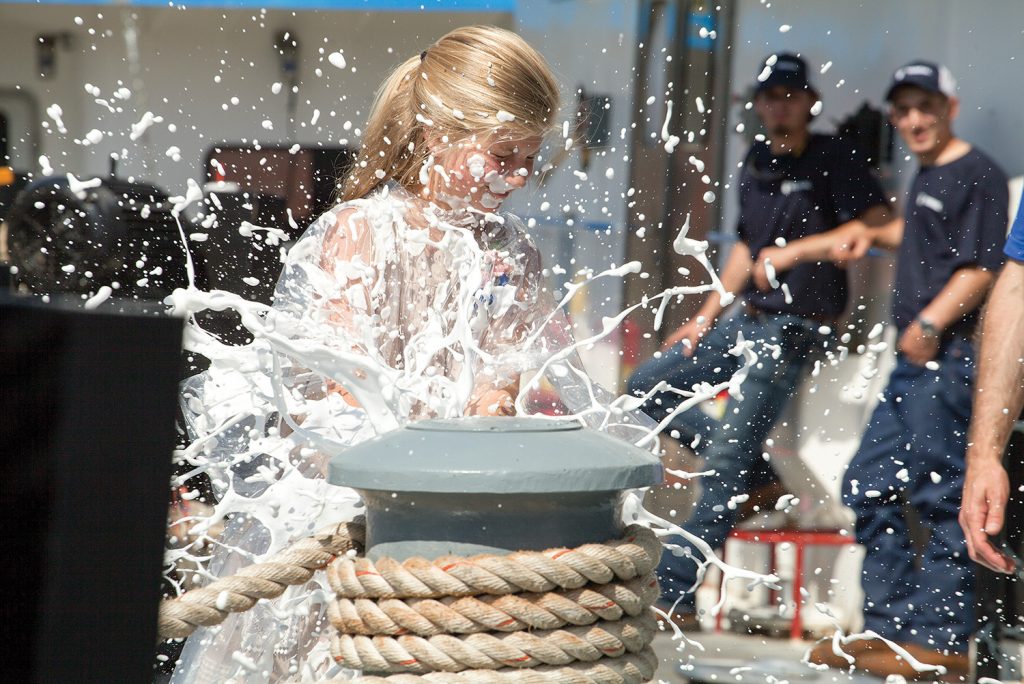 Mary Elizabeth Gattle christens her namesake boat.