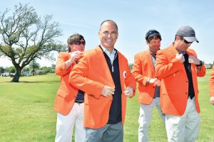 Morning flight winners receive their orange jackets.