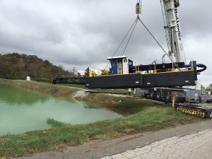 A woman-owned dredging business, Energy Resources Inc. operates three small dredges and collects sediment into geotubes for removal. 