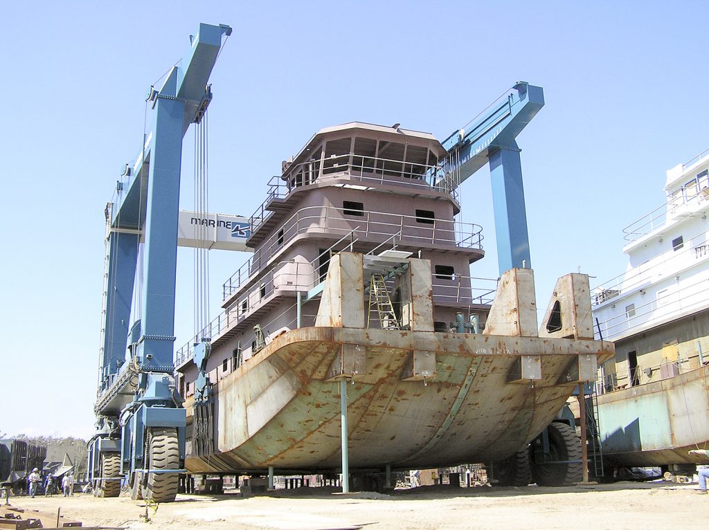 A steel towboat built by Horizon Shipbuilding on the 660-ton Travelift at Metal Shark’s newly-acquired Alabama Shipyard. (Photo courtesy of Metal Shark)