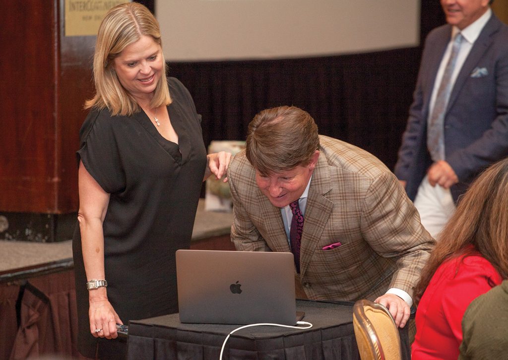 Dawn Lopez and David Fennelly of Associated Terminals and Turn Services speak to Bill Bergeron via FaceTime. (Photo by Frank McCormack)