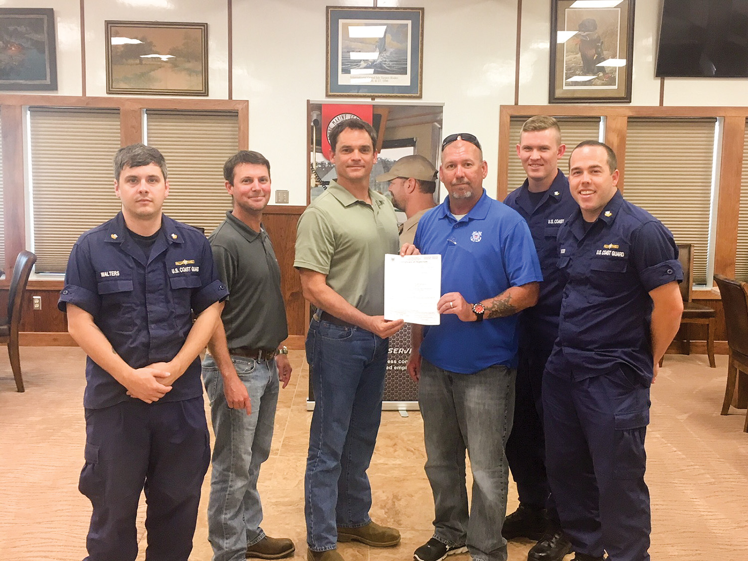 From left are: Coast Guard Petty Officer Andrew Walters; Cenac Compliance Manager Dustin Walker, Cenac Safety Manager Tim Moore; Jeff Scott, also with Cenac; Coast Guard Petty Officer Joshua Mull and Coast Guard Petty Officer Cory Basso.