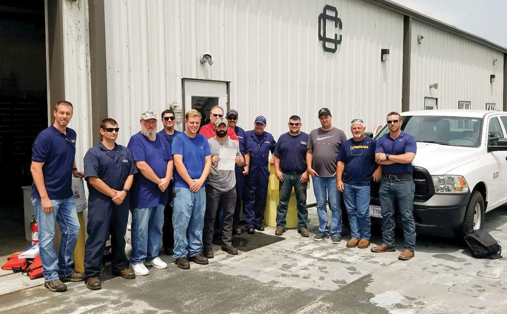 The crew of the mv. Eva Kelley line up outside of a Crounse Corporation facility to receive one of two COIs from TVIB. It’s the first COI issued by Marine Safety Unit Paducah. (photo courtesy of the Towing Vessel Inspection Bureau)