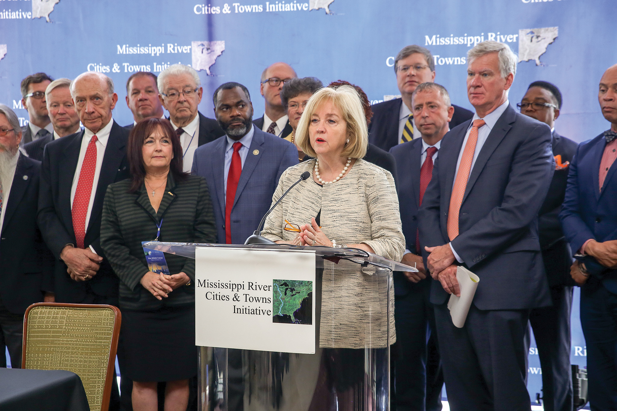 Flanked by mayors of other Mississippi River communities, St. Louis Mayor Lyda Krewson addresses attendees at a recent St. Louis meeting of Mississippi River Cities and Towns Initiative.