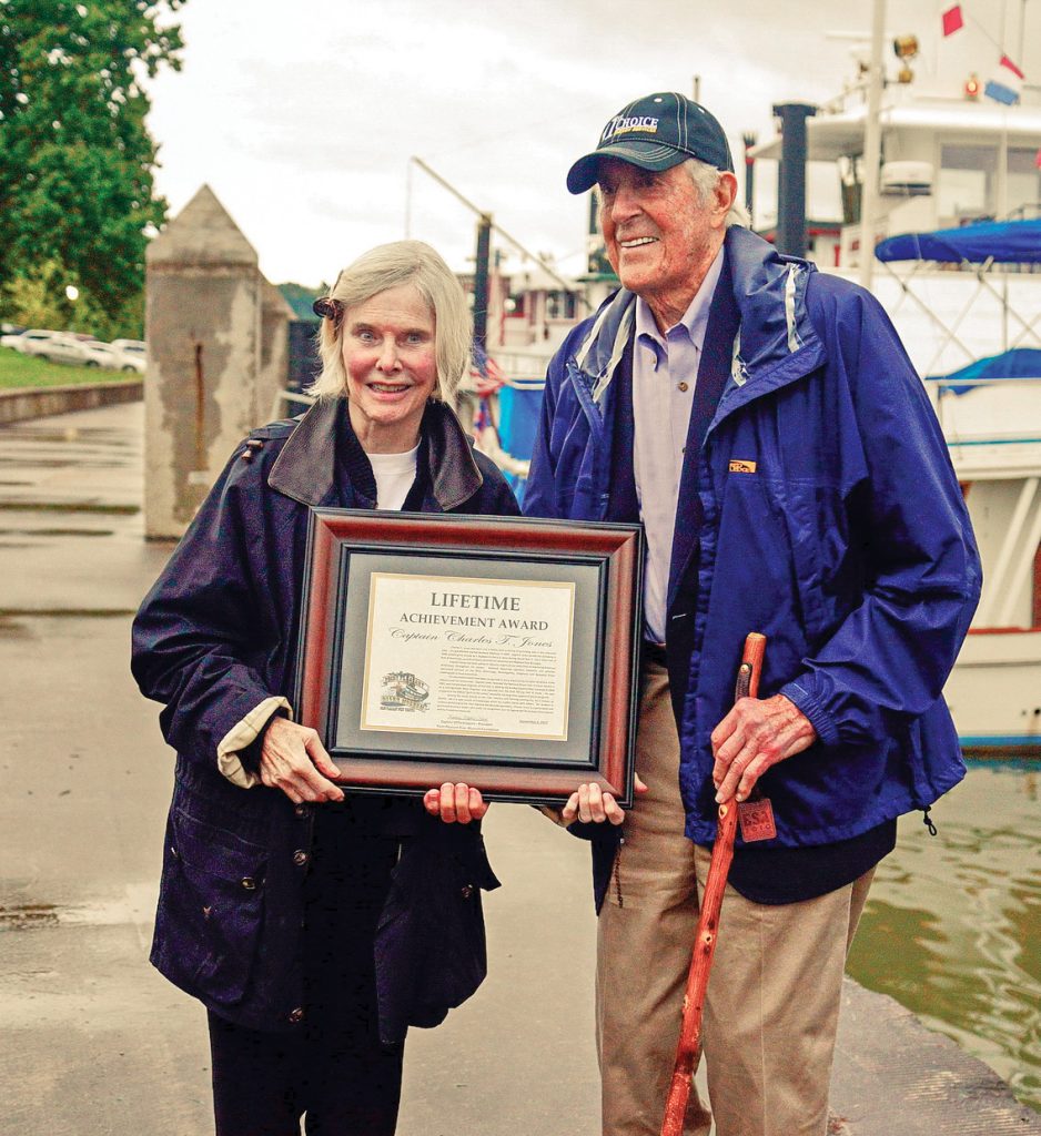 Mary Ellen and Charles T. Jones with Jones’ Lifetime Achievement Award from the Point Pleasant River Museum and Learning Center.