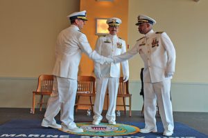 Cmdr. Aaron Demo relieved Cmdr. Leon McClain Jr. as the commanding officer of Coast Guard Marine Safety Unit Pittsburgh during a change of command ceremony at the Heinz History Center in Pittsburgh June 27. (Coast Guard photo by Lt. Shawn Simeral)