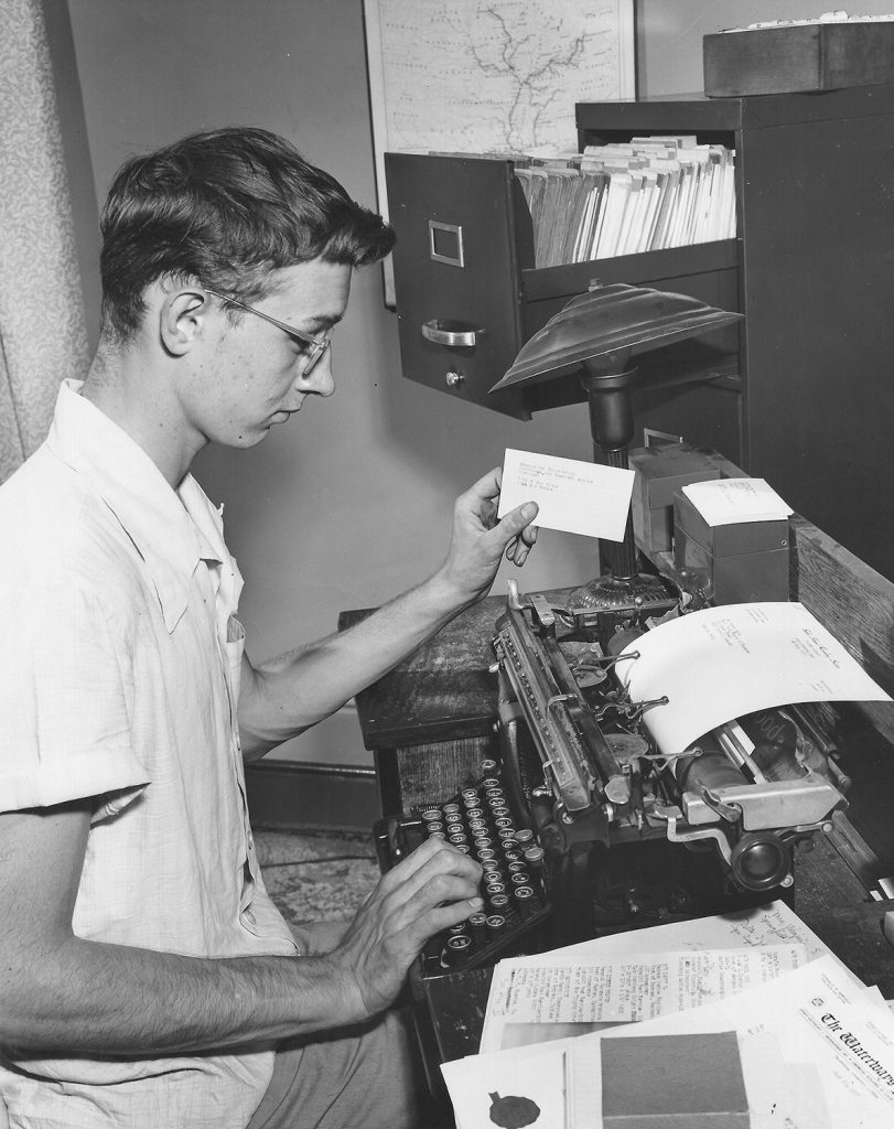 A young Dan Owen works on his towboat database.