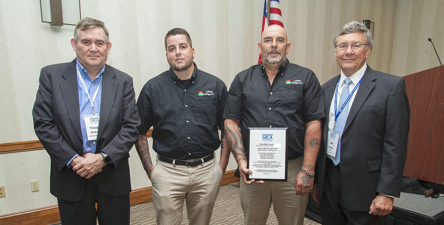 Jim Stark, president of the Gulf Intracoastal Canal Association, recognizes members of LeBeouf Towing for their response to the March 12 sinking of the mv. Natalie Jean on the Mississippi River in New Orleans. Pictured are, from left to right, Vaughn McDaniel, operations manager for LeBeouf Bros. Towing; Shane Thobodeaux, former pilot aboard the mv. Earl Gonsoulin; Danny Mathern, relief captain on the Earl Gonsoulin; and Jim Stark, GICA president. (Photo by Frank McCormack)