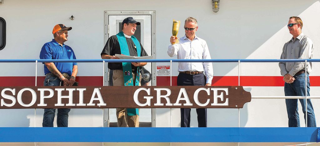 From left: Capt. Johney Hoppe, Rev. Thomas Rhoades, Don Robinson and Craig Lagrone. (Photo courtesy of NGL Marine)