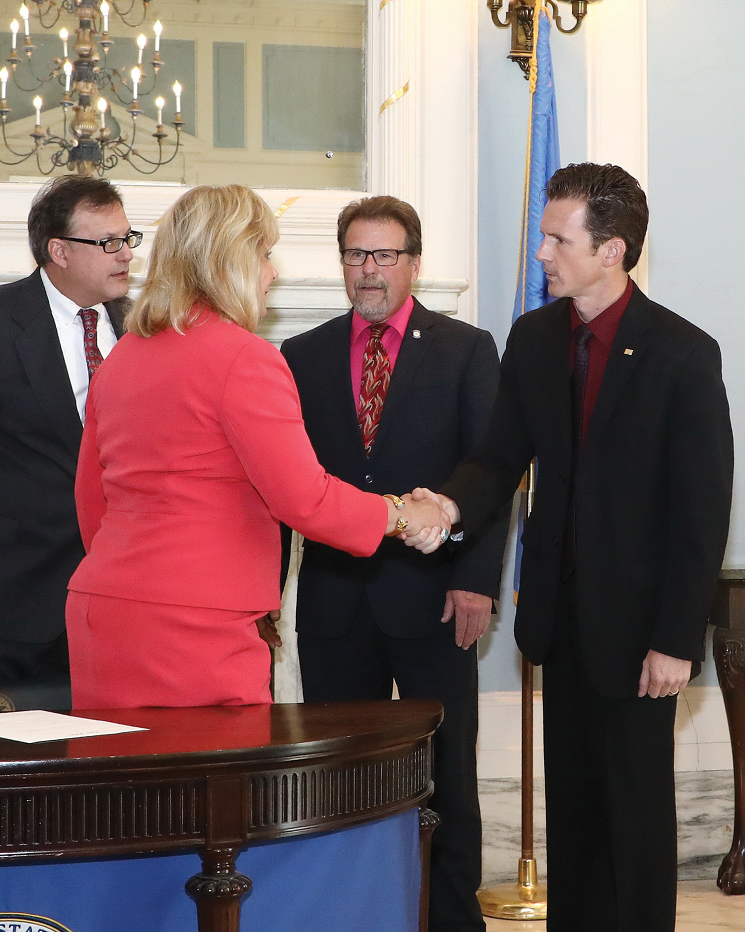 Brad Banks, manager of operations at the Tulsa Port of Catoosa, meets with Gov. Mary Fallin and state representatives for the official bill signing ceremony. (Photo courtesy of Tulsa Port of Catoosa)