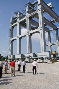 “Super Gantry” crane specially built for Olmsted construction is the largest in North America; it is 10 stories tall with a lifting capacity of 5,304 tons. It is shown here during an Inland Waterways Users Board visit in 2009. (Photo by John Shoulberg)