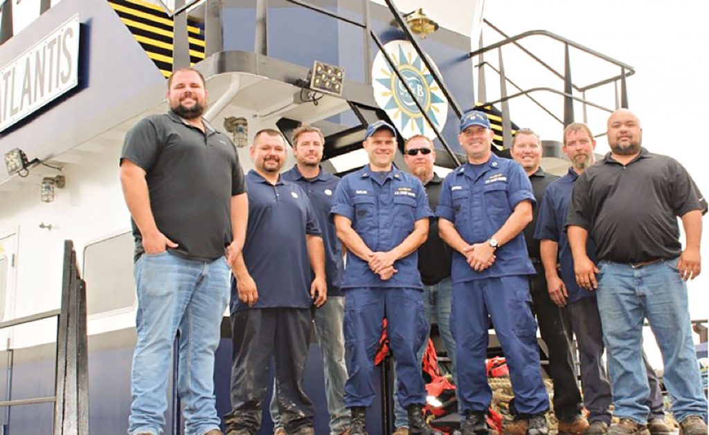 From left, Randal Lapikas, pilot; Ira Baker, mechanic; Joshua Castle, deckhand; CWO Michael McClain, marine inspector, MSD Cincinnati; Lt. Jim Brendel, supervisor of MSD Cincinnati; Greg Chapman, deckhand; Mike McNeely, steersman; Brandon Phillips, lead mechanic; and Jason Inman, pilot.