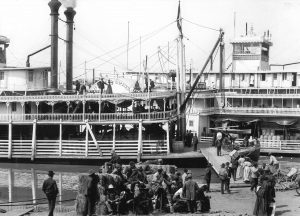 Roustabouts and passengers board the Belle of Calhoun at the Vicksburg levee in 1906. The Belle of the Bends is landed alongside.  (Photo from Keith Norrington collection.)