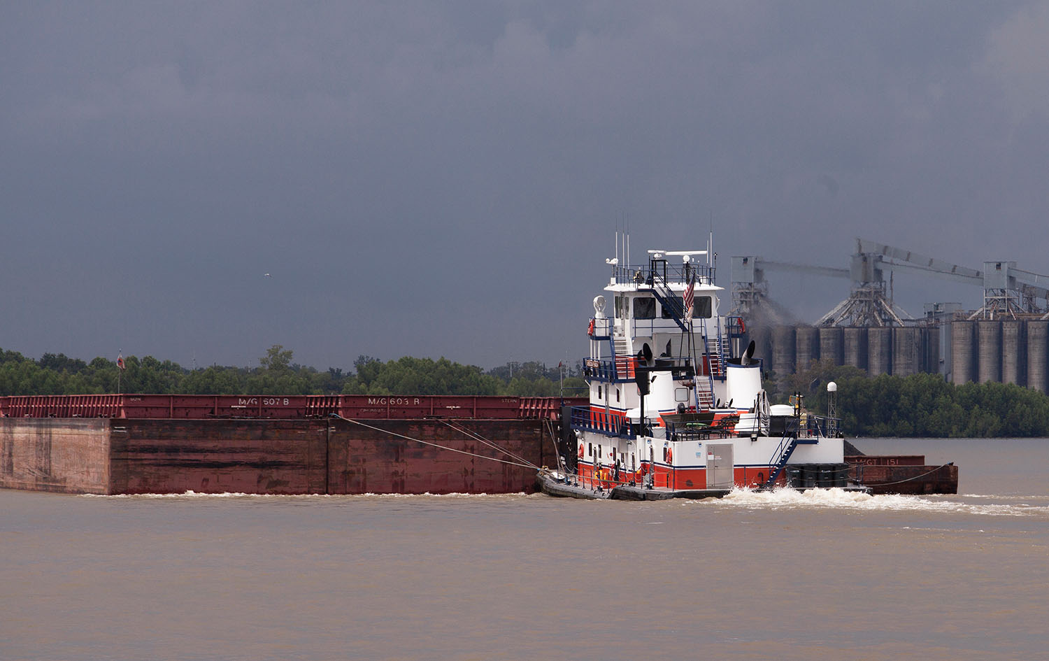 The mv. American Pharoah, part of Turn Service’s fleet of towboats, pushes a tow of open hopper barges in the New Orleans area. (Photo by Frank McCormack)