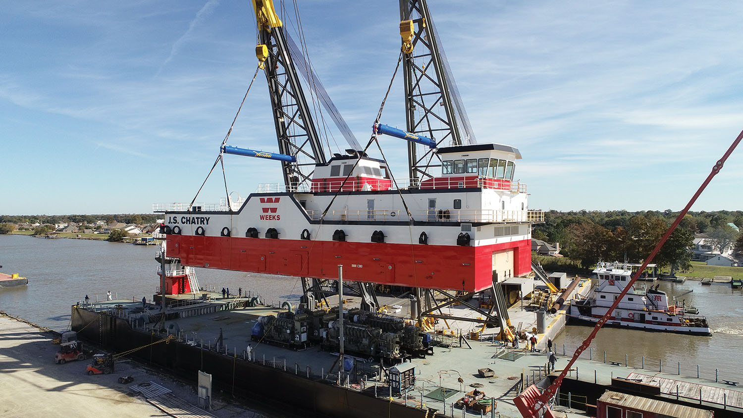 McKinney Salvage & Heavy Lift derrick barges move dredge superstructure onto hull. (Photo courtesy of C&C Marine & Repair)