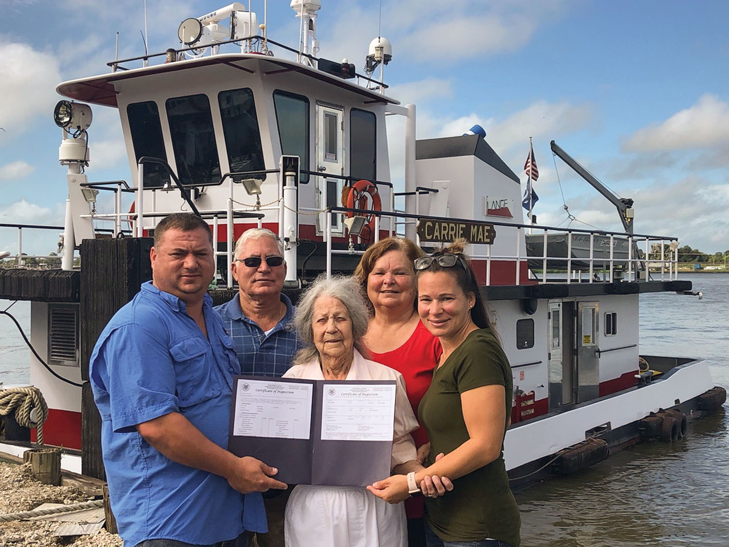 Lange Towing owner operators Capt. George Lange Jr. and George Lange Sr.; Carrie Lange, wife of the late Wilbur Lange; Daisy Lange, wife of George Lange Sr.; and KMS Safety’s Kimberly Macaluso, daughter of George Lange Sr. (Photo courtesy of Lange Towing)