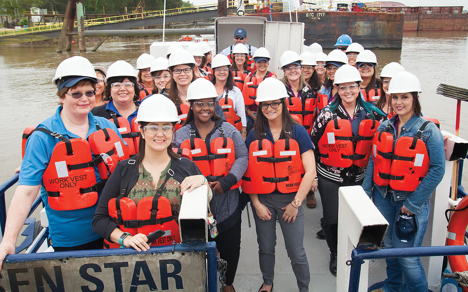 Members of WIMOs take a tour of ACBL’s Convent, La., fleet. (Photo by Frank McCormack)