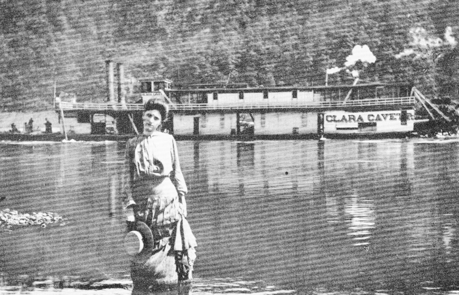 A woman poses for the photographer as the Clara Cavett passes by in 1906. (Keith Norrington collection)