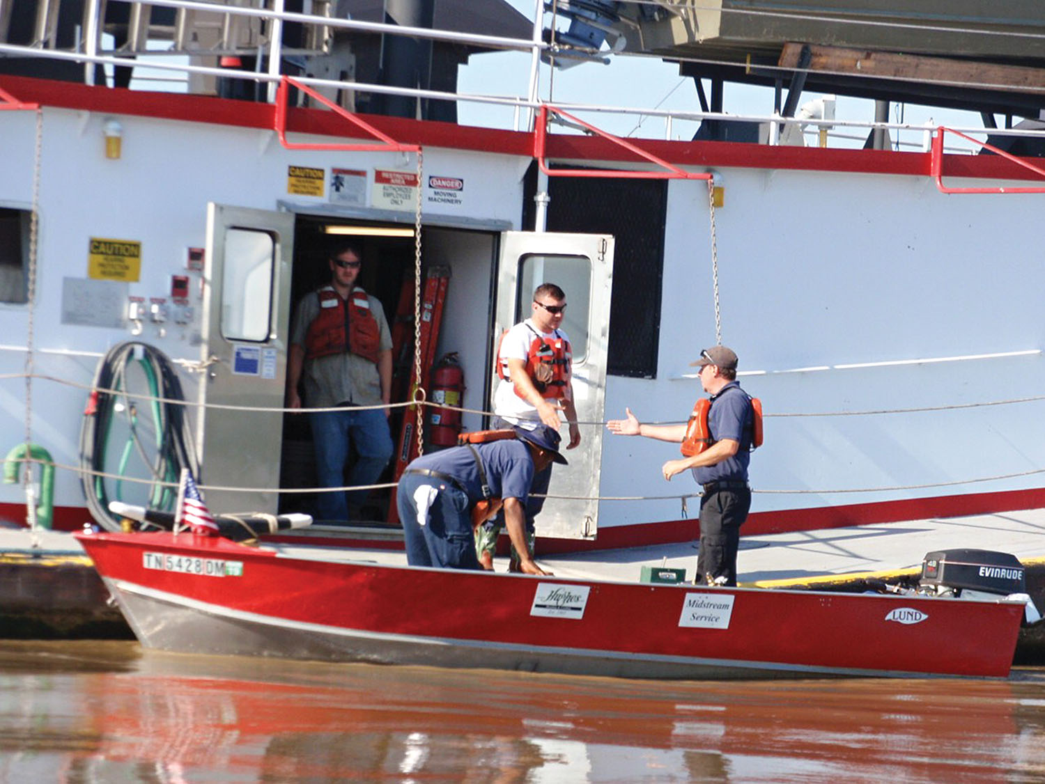 Hughes workers arrive at a towboat for a service call. (Photo courtesy of Hughes Heating & Cooling)