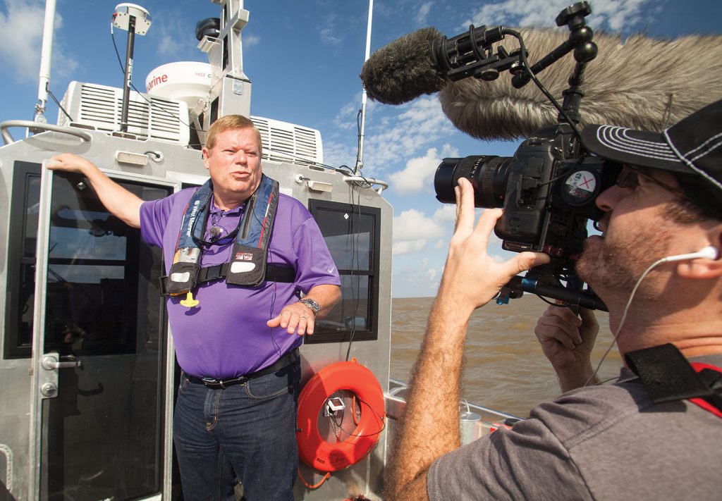 A documentary film maker interviews Port of Morgan City Executive Director Mac Wade on the importance of adequate dredge funding for the port’s ship channel. (Photo by Frank McCormack)