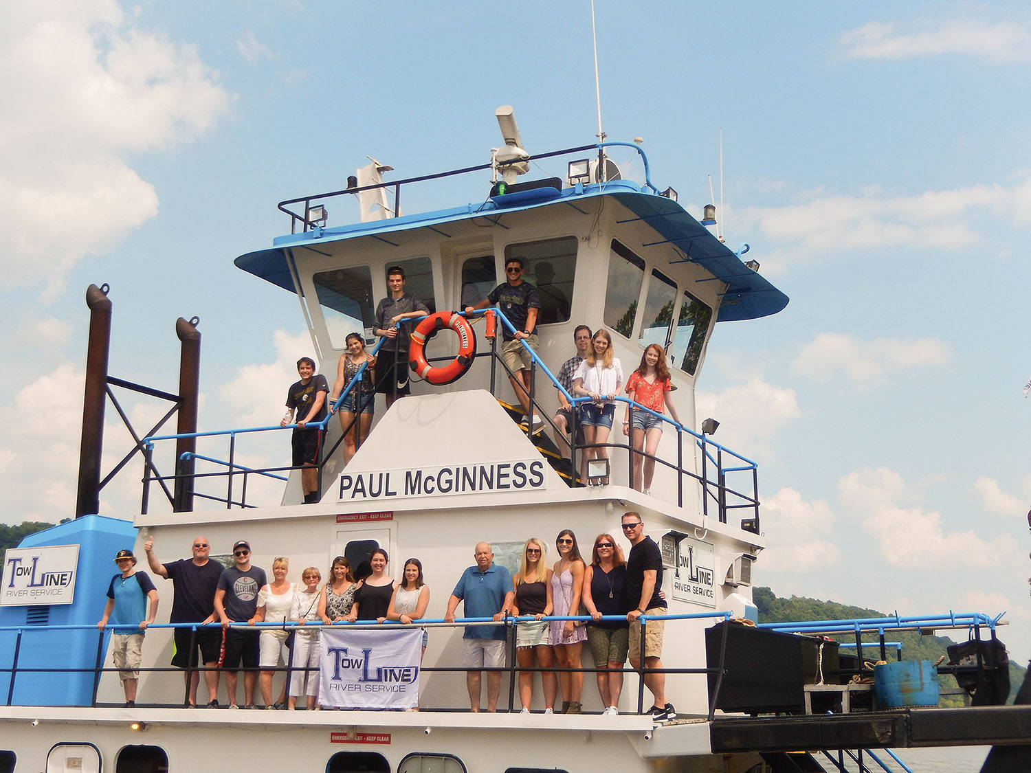 The Fedkoe and McGinness families celebrate the christening of the newly refurbished mv. Paul McGinness.