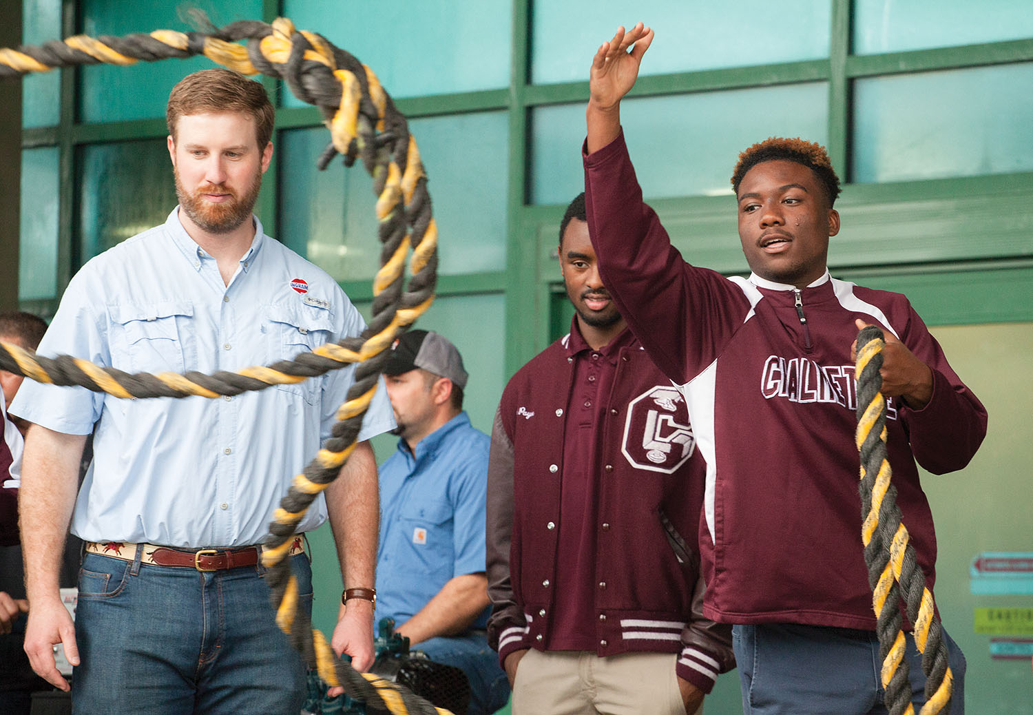 Aaron Kouri from Custom Fuel Services, part of Ingram Marine Group, teaches Chalmette High School students how to throw a line.