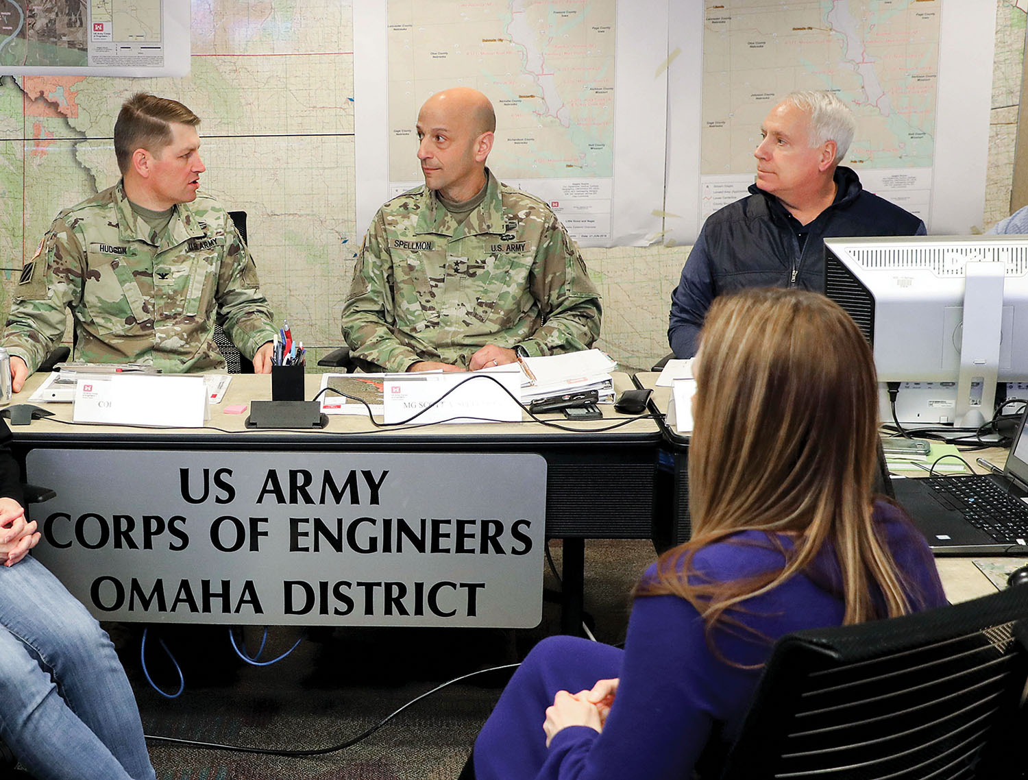 Col. John Hudson (left), commander, deputy commanding general for civil works and emergency operations; Maj. Gen. Scott Spellmon; and Contingency Operations and Homeland Security Director Charles Alexander Jr. receive a briefing on flood fighting in the upper Missouri River basin in the emergency operations center of the Omaha District headquarters March 20. (Photo courtesy of Omaha Engineer District)