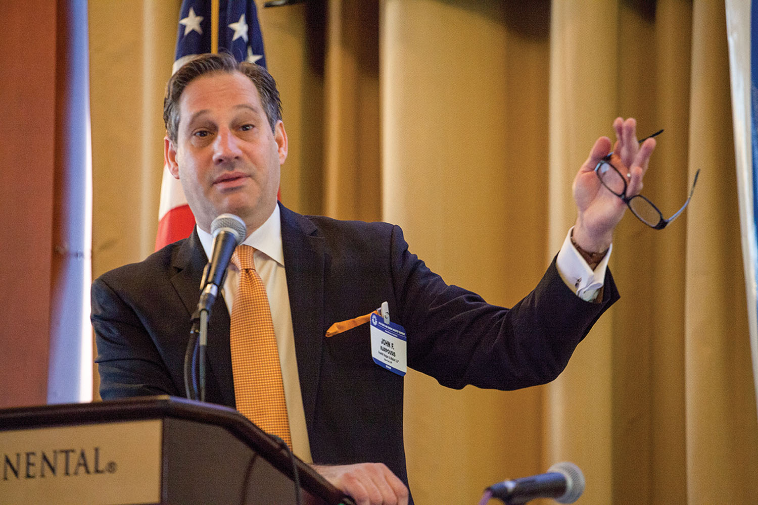 Attorney John Karpousis gestures as he makes a point. (Photo by David Murray)