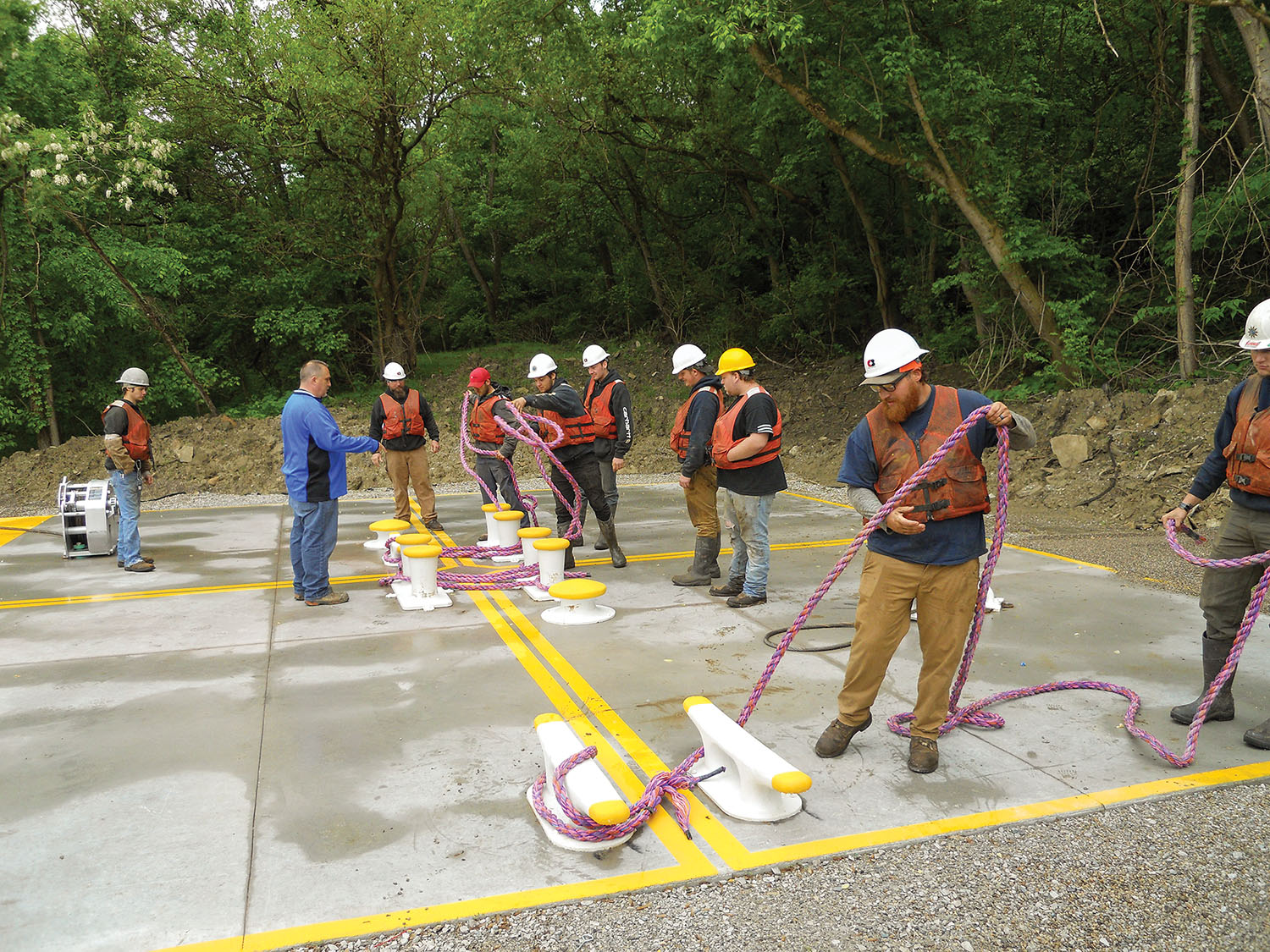 New employees “learn the ropes” on C&B’s new training pad, which simulates a four-barge coupling. (Photo courtesy of C&B Marine)