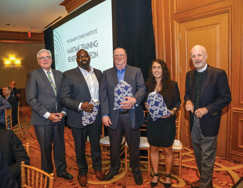 Presenter Mark Knoy, president and CEO of American Commercial Barge Line, Capt. Steve Harris of Golding Barge Line, Capt. Troy Green of Blessey Marine Services, Capt. Stephanie Cavaliere of Kirby Inland Marine and Rev. David M. Rider, president and executive director of Seamen’s Church Institute. (Photo courtesy of Seamen’s Church Institute)