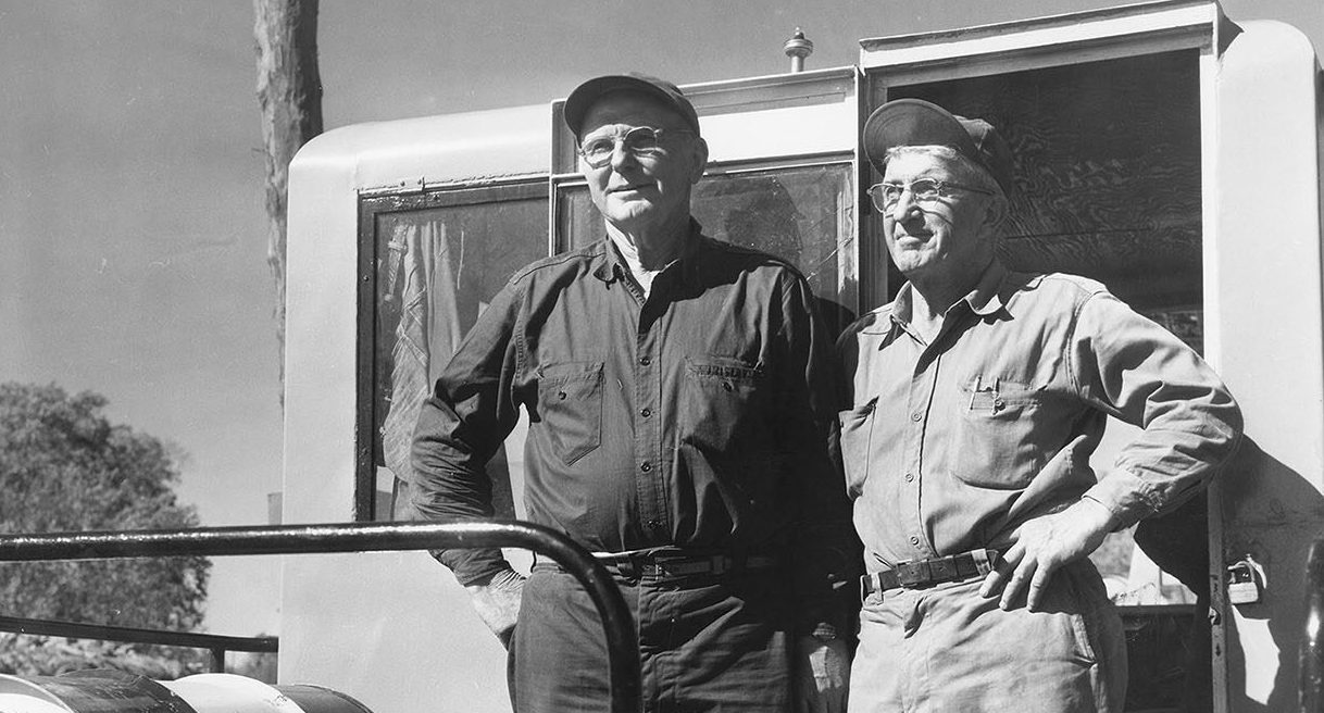 Gene (left) and Jim Brennan on the job at construction of the Winneshiek Slough Bridge during 1955-1956.