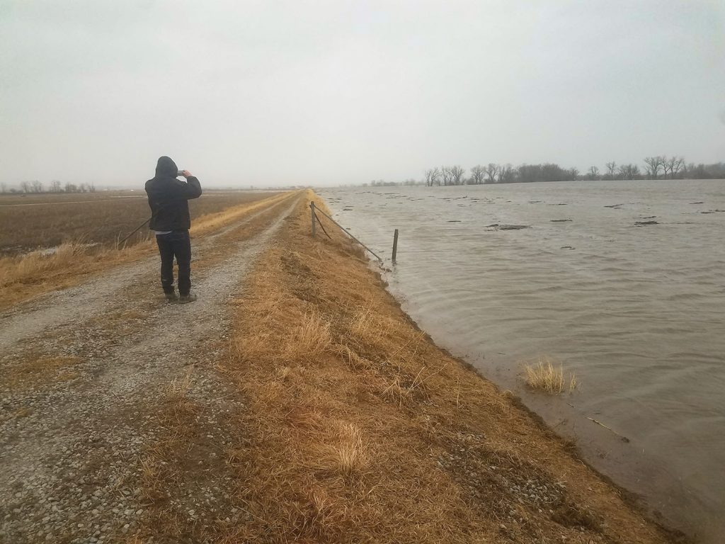 Missouri River water nears the top of levee L611-614 south of Hwy. 34 and Council Bluffs, Iowa, in this photo looking downstream on March 14. A breach was reported in this stretch on March 19. (Photo courtesy of Omaha Engineer District)