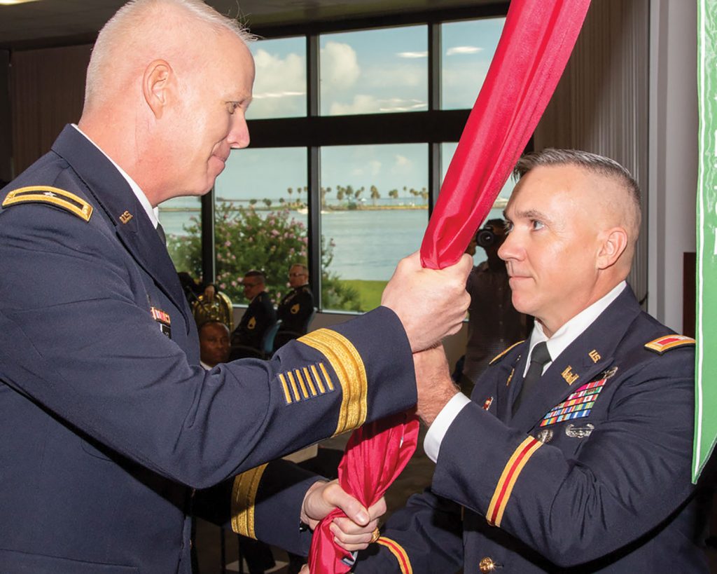 passes the command of the Galveston Engineer District to Col. Timothy Vail during a change of command ceremony July 2 at the district’s Jadwin Building in Galveston, Texas. Southwestern Engineer Division Commander Brig. Gen. Paul Owen presided over the ceremony. (Corps of Engineers photo by Col. Lars Zetterstrom)