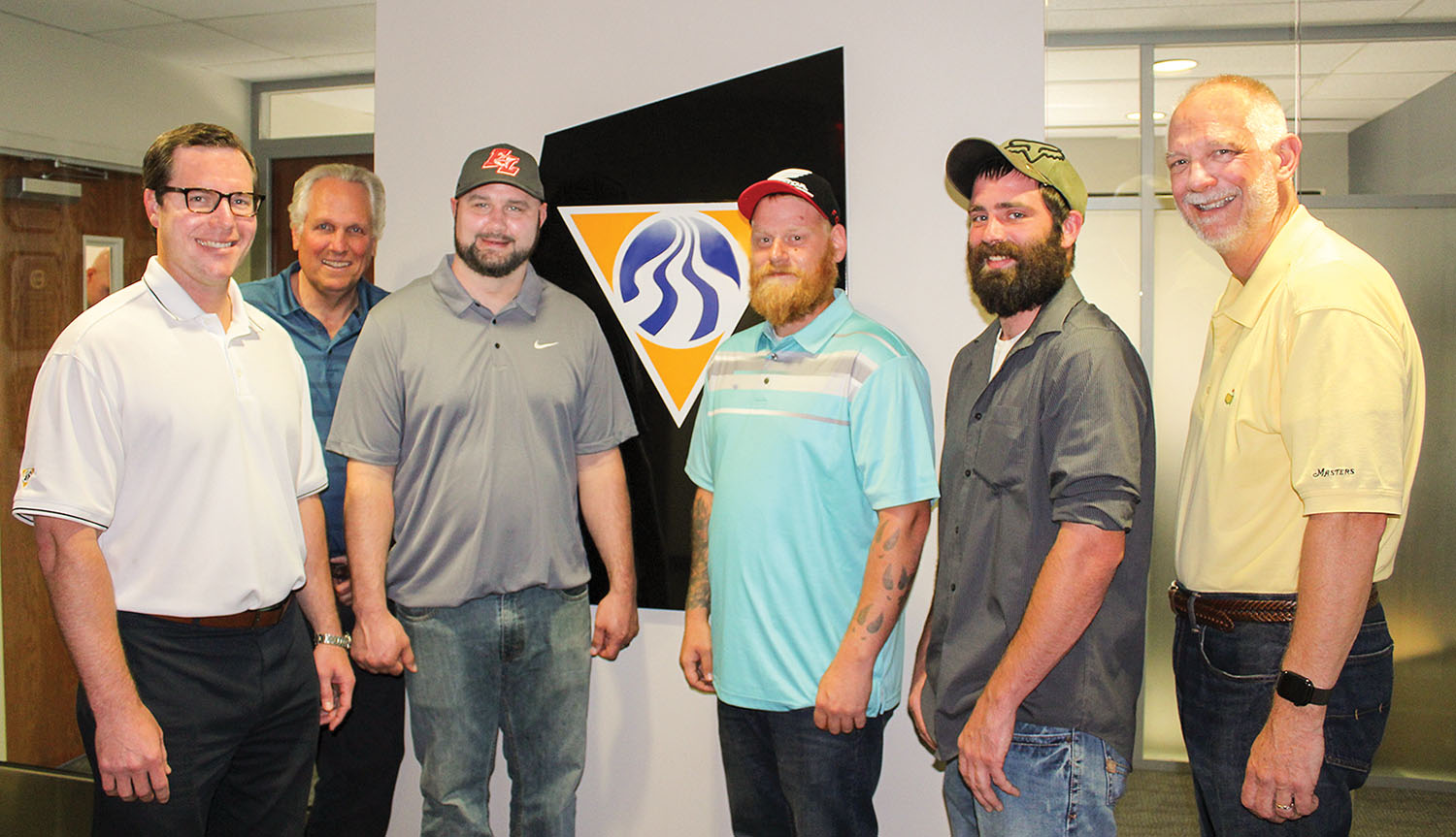 From left: Kyle Buese, executive vice president of operations; Peter Stephaich, CEO and chairman of the board; Capt. James Blake Jr.; Travis Neely, deckhand; Jared Starkey, deckhand; and Mike Monahan, president.