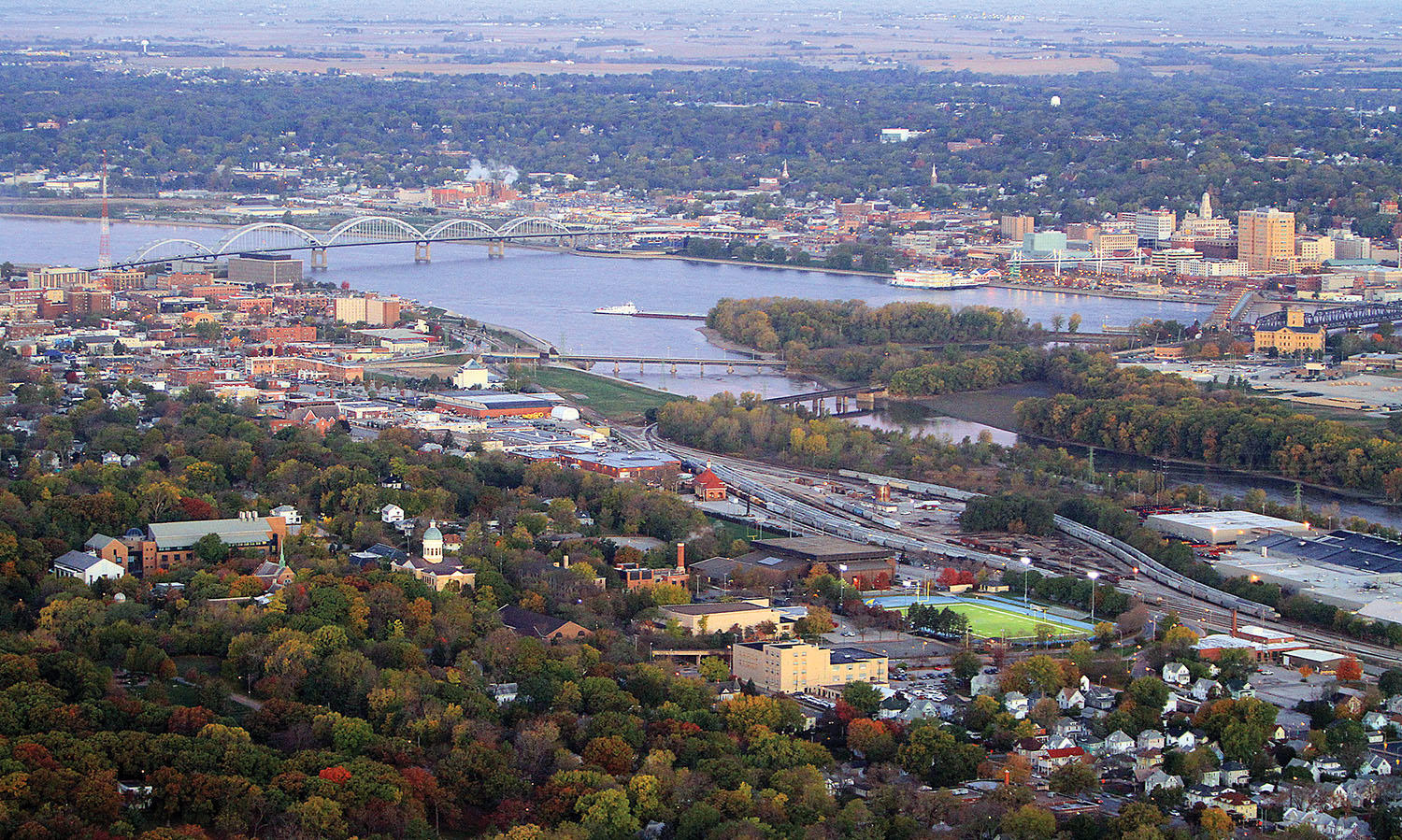 The Centennial Bridge, on the left, and Arsenal Island on the right, are key features of the Mississippi River in the Quad Cities area. Davenport, Iowa, is across the river, and Rock Island, Ill., is in the foreground. (Photo courtesy of Dawson & Associates)