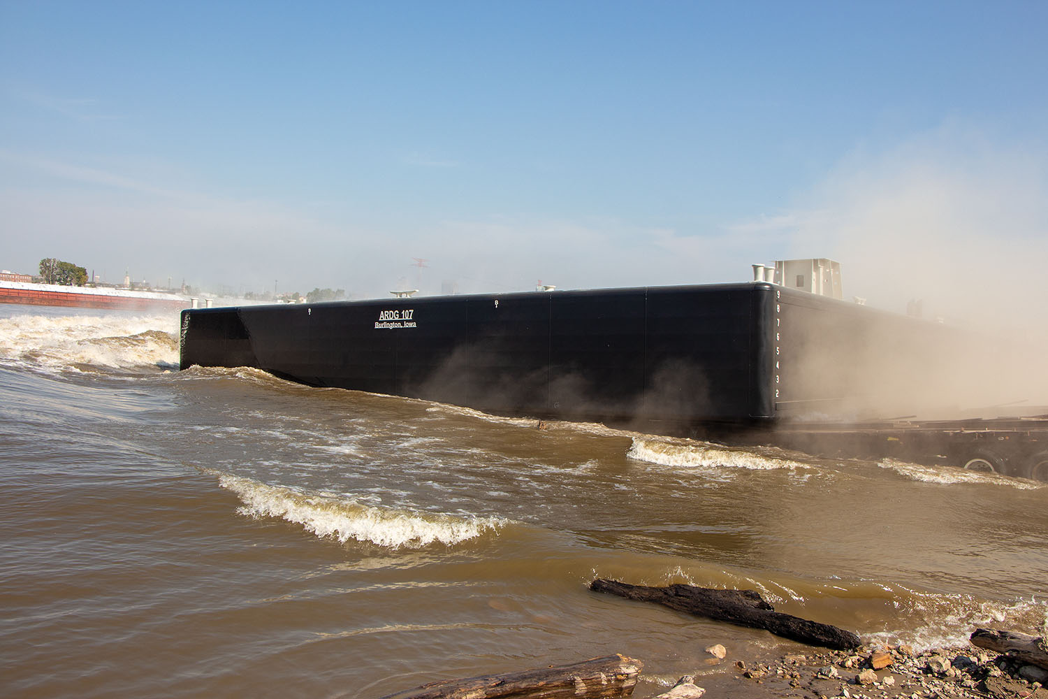 Eagle Fabrication’s one-hundredth barge slides into the Mississippi River at Sauget, Ill. (Photo by Jason Koenig)