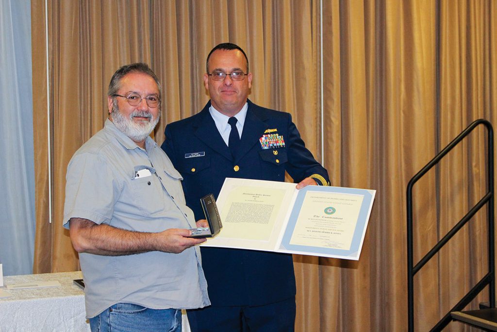 Capt. Dittman presents award to Capt. Roy McManus. (Photo courtesy of Canal Barge Company)