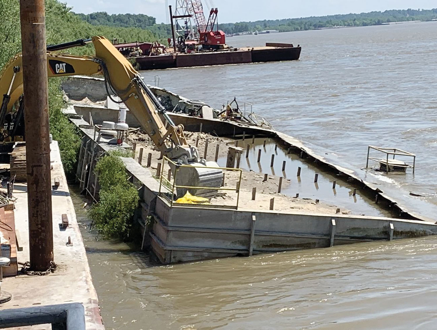 Okie Moore Diving & Marine Salvage recently completed the salvage of this sunken cement barge near Columbus, Ky.