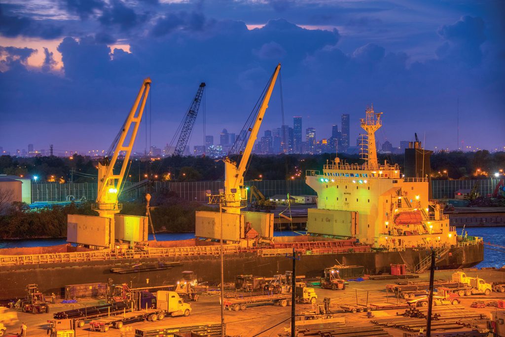 A cargo ship is docked on the Houston Ship Channel, with nearby downtown Houston visible in the distance. (Photo courtesy of Port Houston)