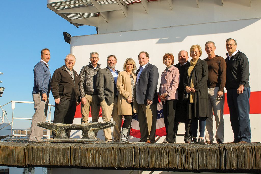 Rick Pemberton (sixth from left) and his family line up for a photo aboard his namesake vessel. (Photo by Shelley Byrne)