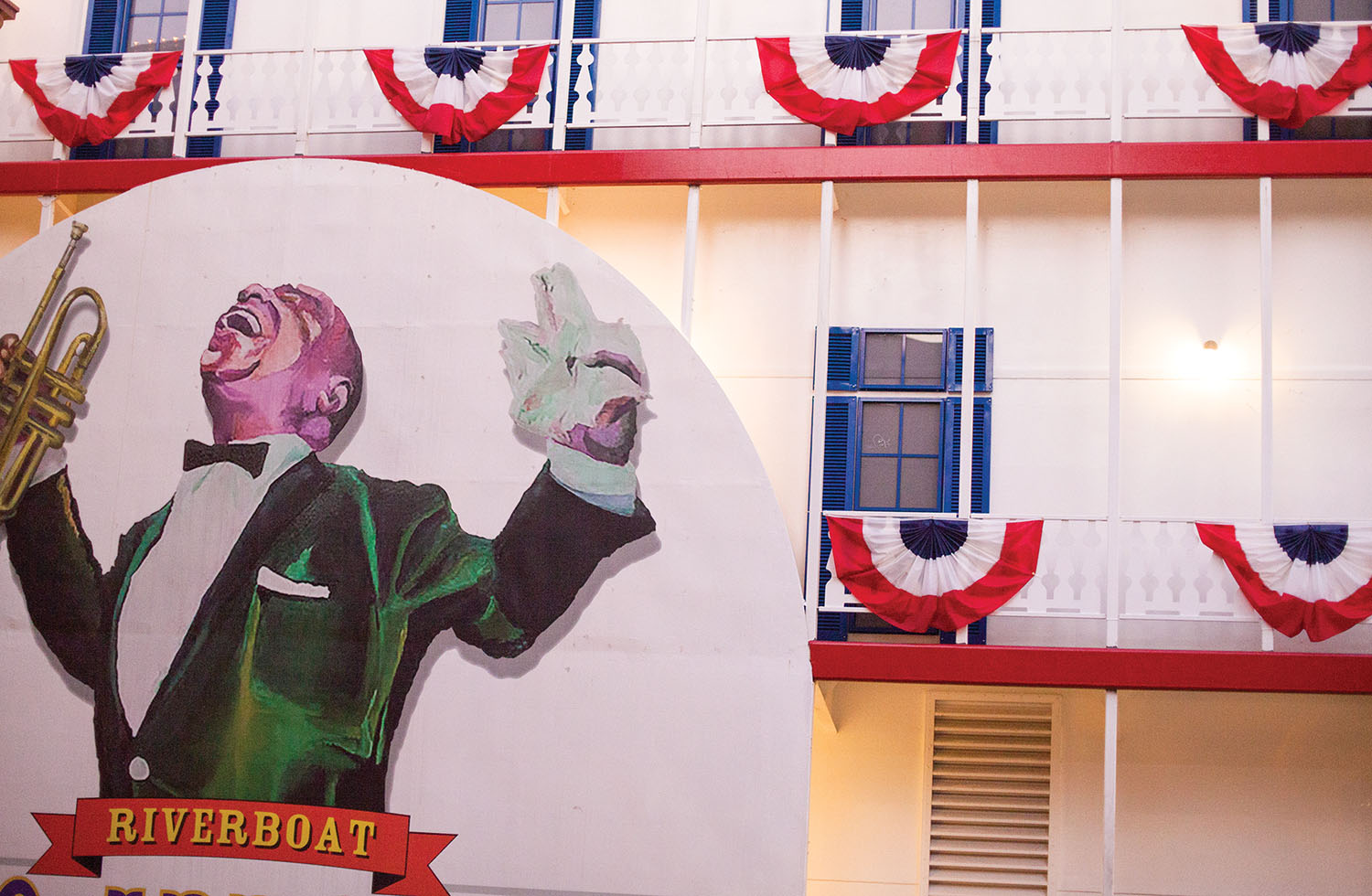 Caption for top photo: “Satchmo’s” likeness on the new New Orleans riverboat named in his honor. (photo by Frank McCormack)