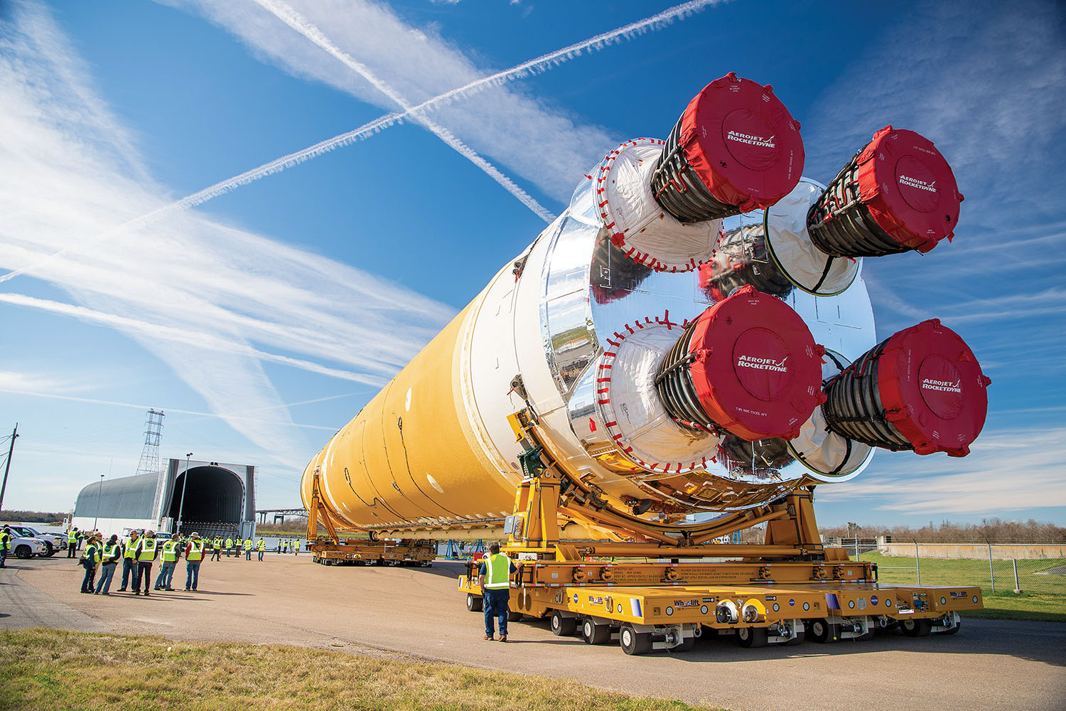 The first Artemis rocket stage is moved from NASA’s Michoud Assembly Facility in New Orleans, La., to the agency’s Pegasus barge January 8, ahead of its journey to NASA’s Stennis Space Center near Bay St. Louis, Miss. Once at Stennis, the core stage will undergo Green Run tests, named for the testing of new or “green” hardware. This is the final test campaign for the rocket ahead of the first Artemis launch, set for this summer. (Photo courtesy of NASA)