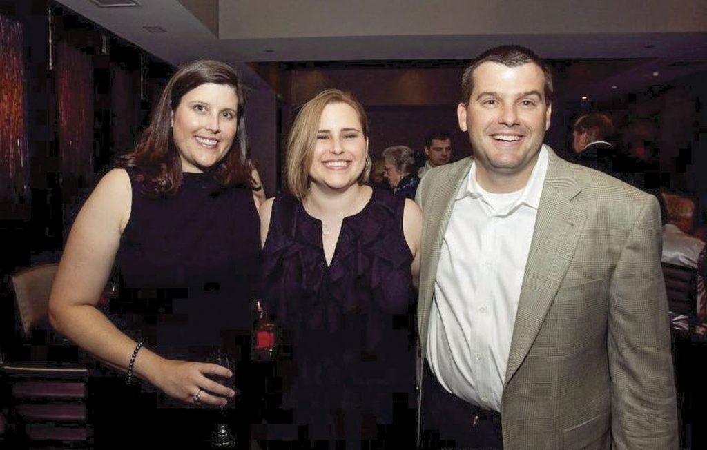 Amanda McMahan, center, the vessel’s namesake, is flanked by her sister, Carter, and brother, Robert. (Photo courtesy of Marine Chartering Associates)