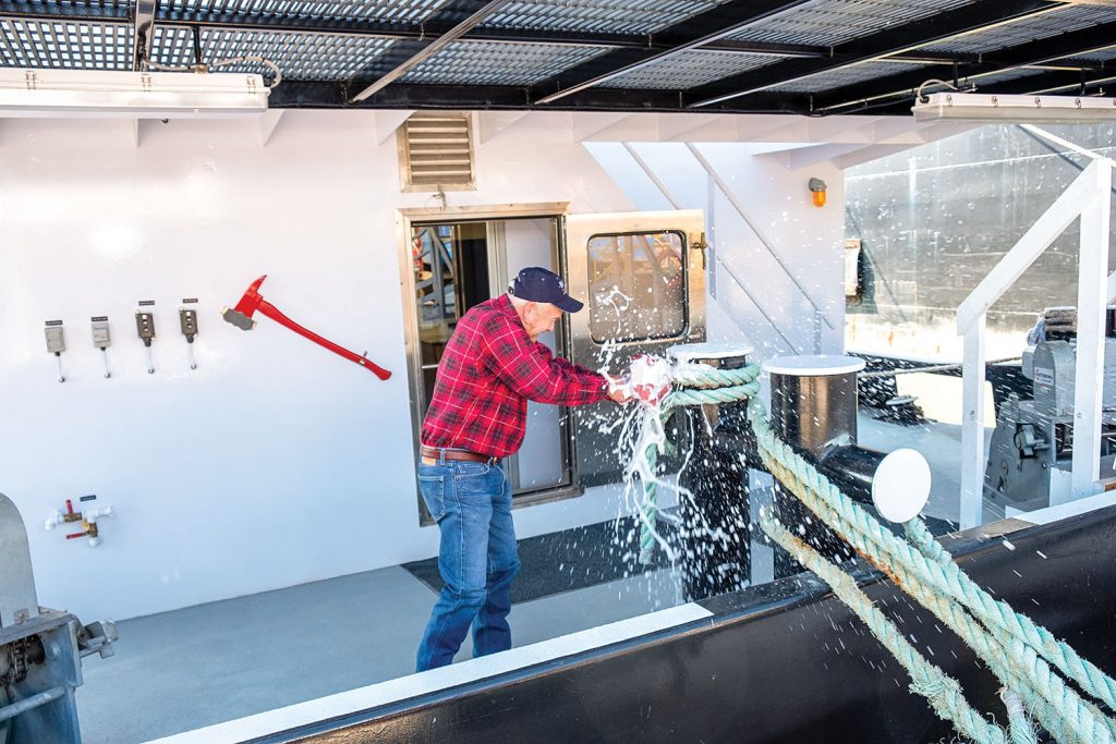 Raymond Butler christens his namesake vessel. (Photo courtesy of John Bludworth Shipyard)