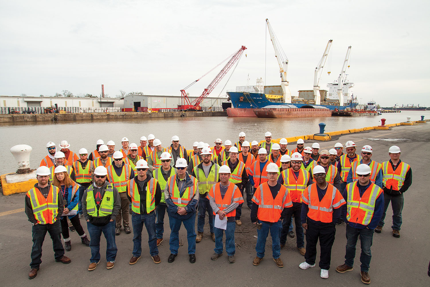 Personnel from the U.S. Army Corps of Engineers gather for a group photo alongside Chalmette Slip, part of Associated Terminals’ Arabi, La., base of operations as part of the January 30 floating plant safety course. (Photo by Frank McCormack)