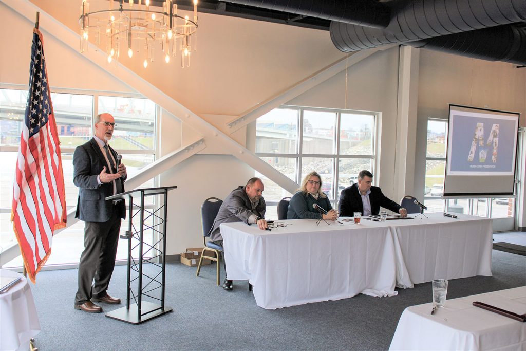 Eric Thomas, president of the Central Ohio River Business Association (CORBA) introduces panelists to discuss the future of container-on-barge services. From left are Mike Leopold of Mubea North America, Nicole Favorite of Horizon Freight System Inc. and Rich Teubner of SEACOR AMH LLC. (Photo by Shelley Byrne)