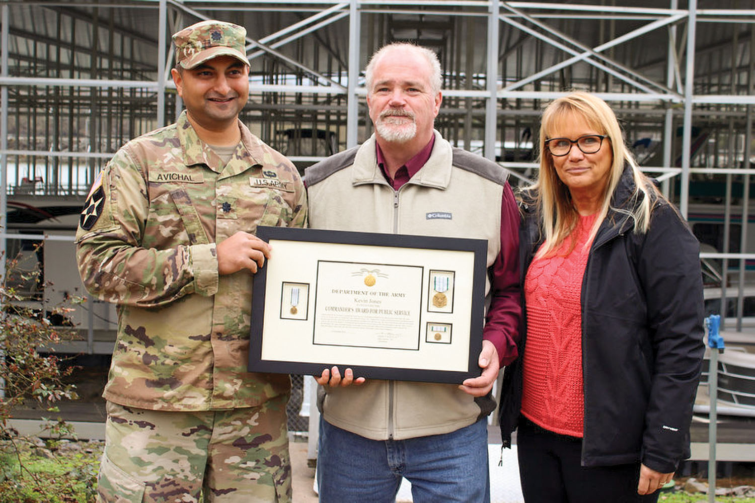 Lt. Col. Sonny B. Avichal, Nashville Engineer District commander, left, with Kevin and Donna Jones. The Corps presented Kevin Jones with the Army Commander’s Award for Public Service after he rescued a man whose vehicle entered a water at a marina boat ramp. Kevin Jones is one of the co-owners of Wildwood Resort and Marina on Cordell Hull Lake in Granville, Tenn. (Photo by Ashley Webster, U.S. Army Corps of Engineers)